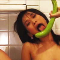 teen asian bitch fucks her pie hole with vegetables in the kitchen